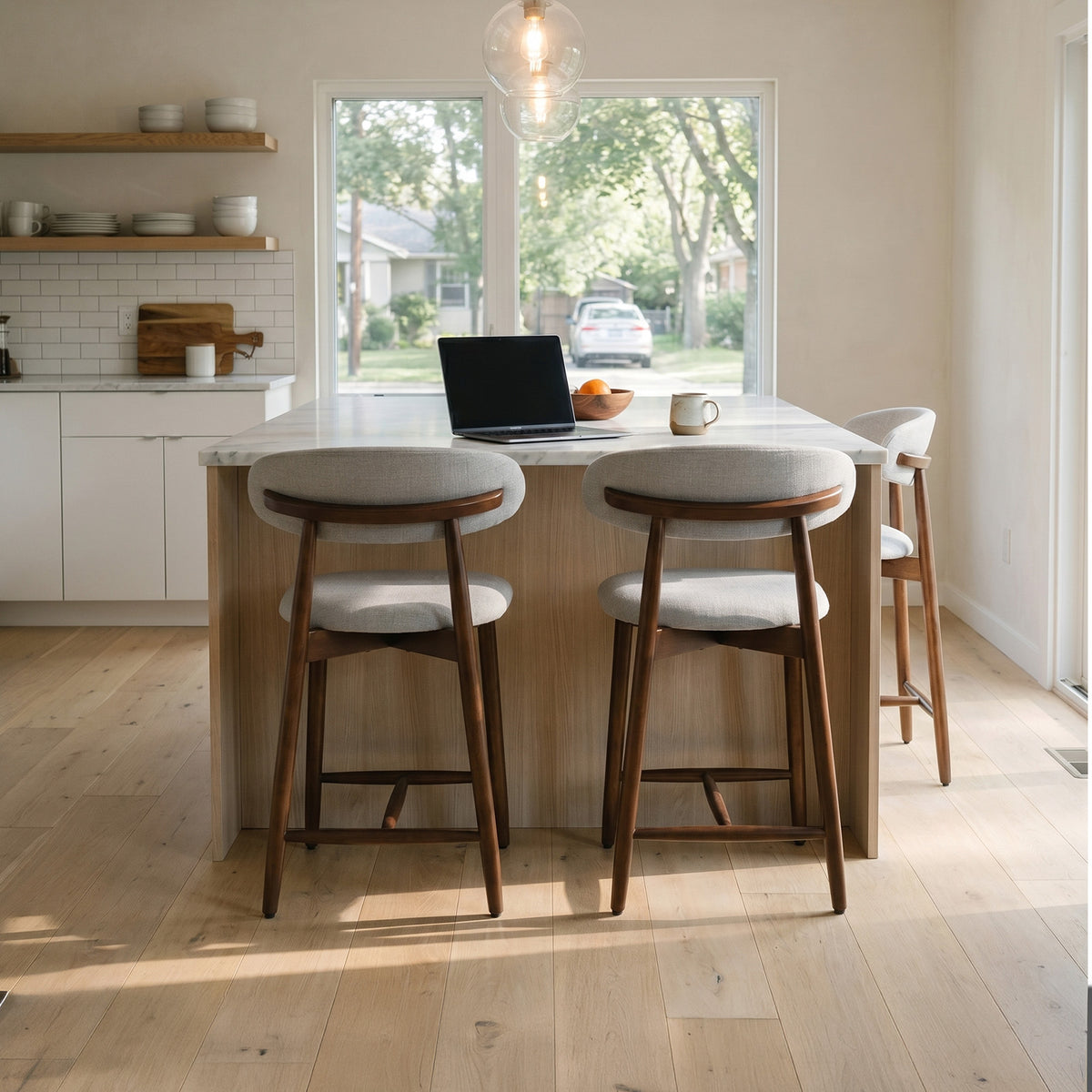 Modern kitchen with Colamy upholstered bar stools, and a laptop.