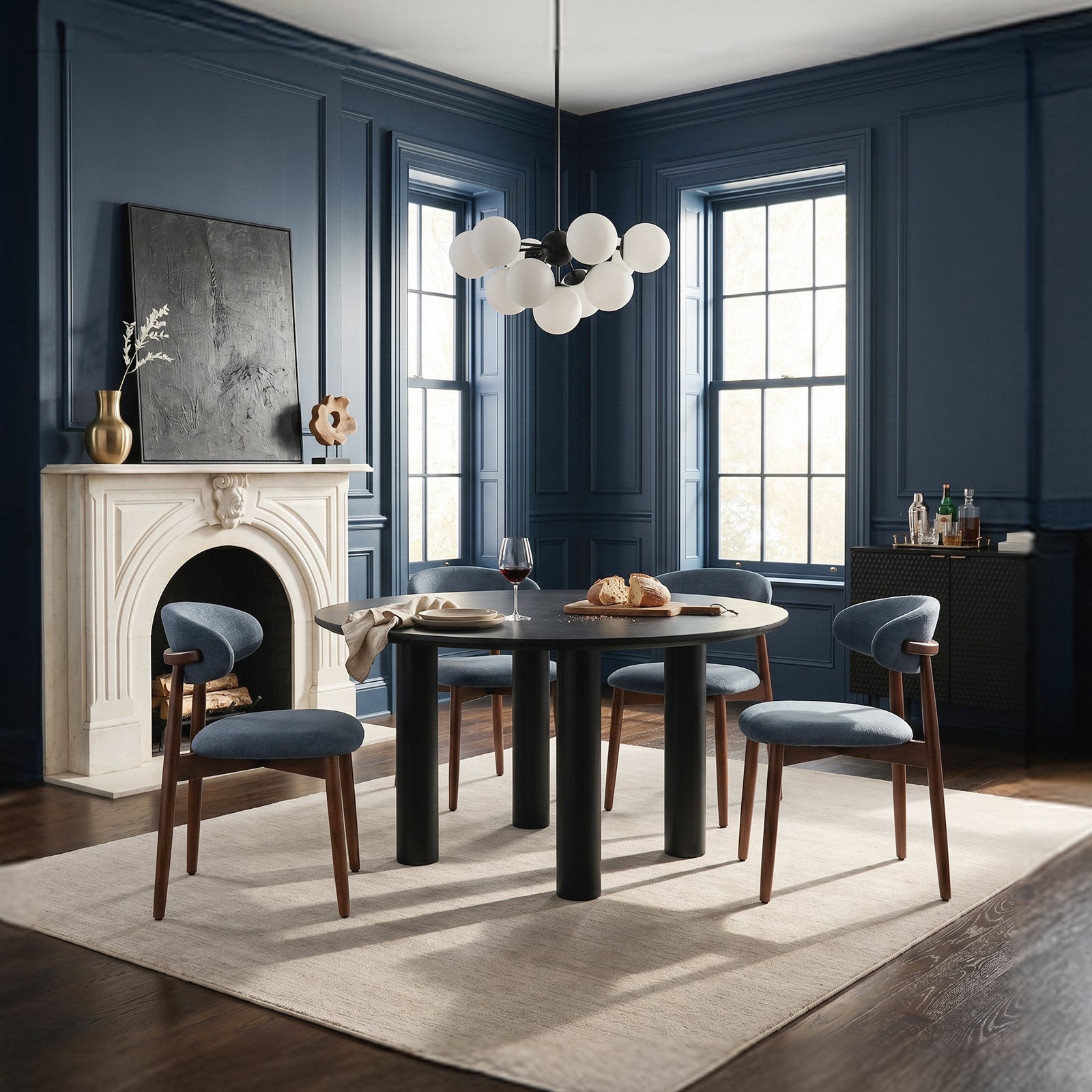 COLAMY NOYA blue upholstered dining chairs with wooden legs in a stylish dark blue dining room