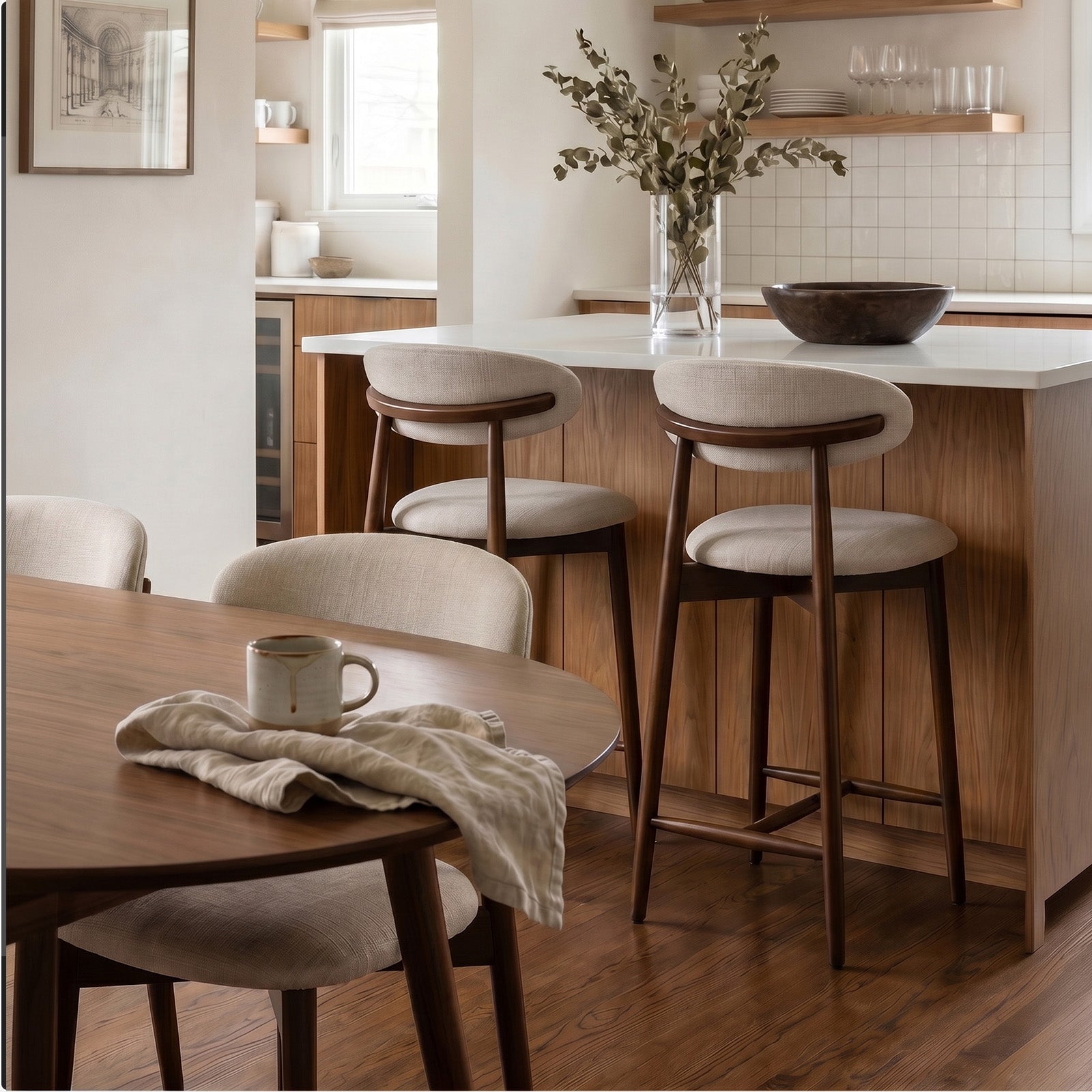 Modern kitchen with wooden dining table and Colamy upholstered bar stools, featuring a vase of flowers on the counter.