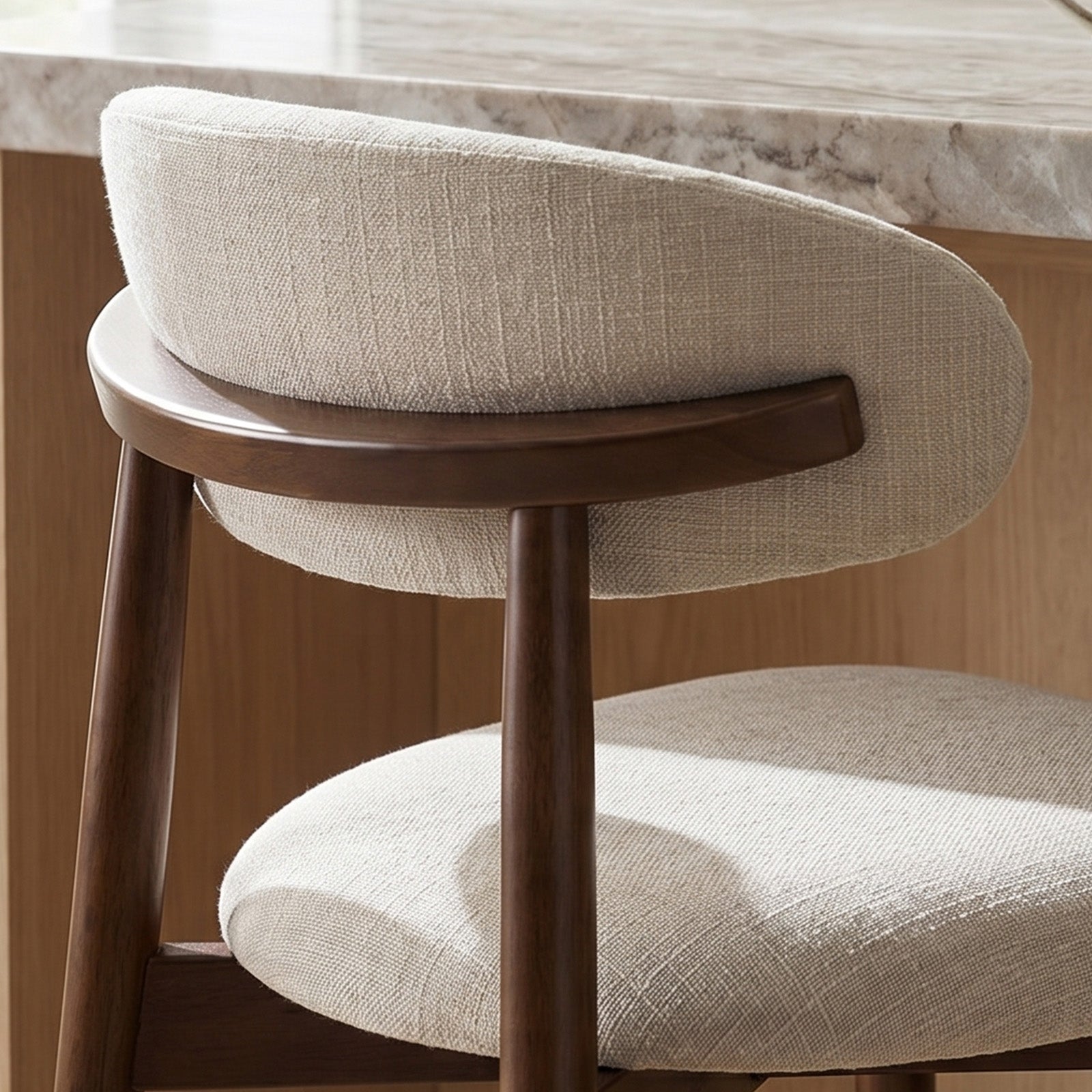 Beige cushioned Colamy upholstered Bar Stool with wooden legs in a room setting