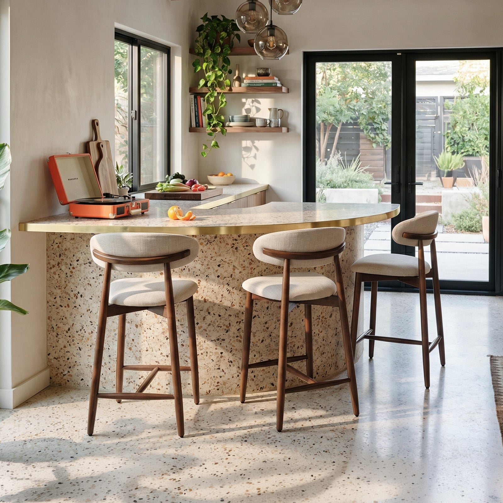 Modern kitchen with a Colamy upholstered bar stools, featuring a vinyl record player and plants.